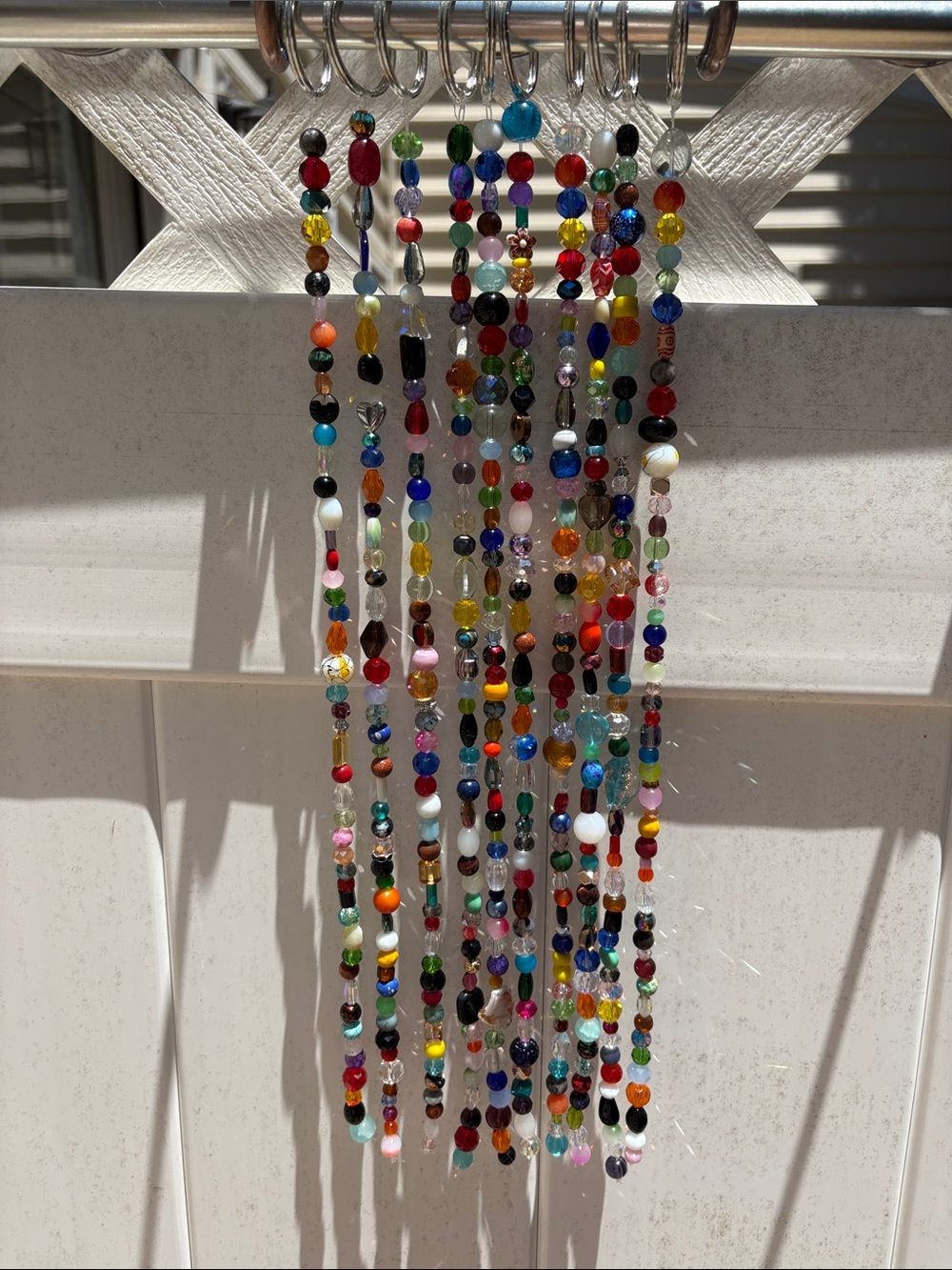 Ten strands that are 16 inches long made with glass & crystal beads